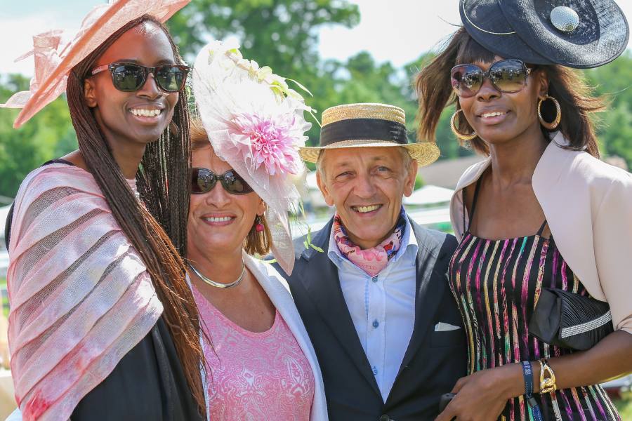 Group of people dressed to attend a horse race in Virginia