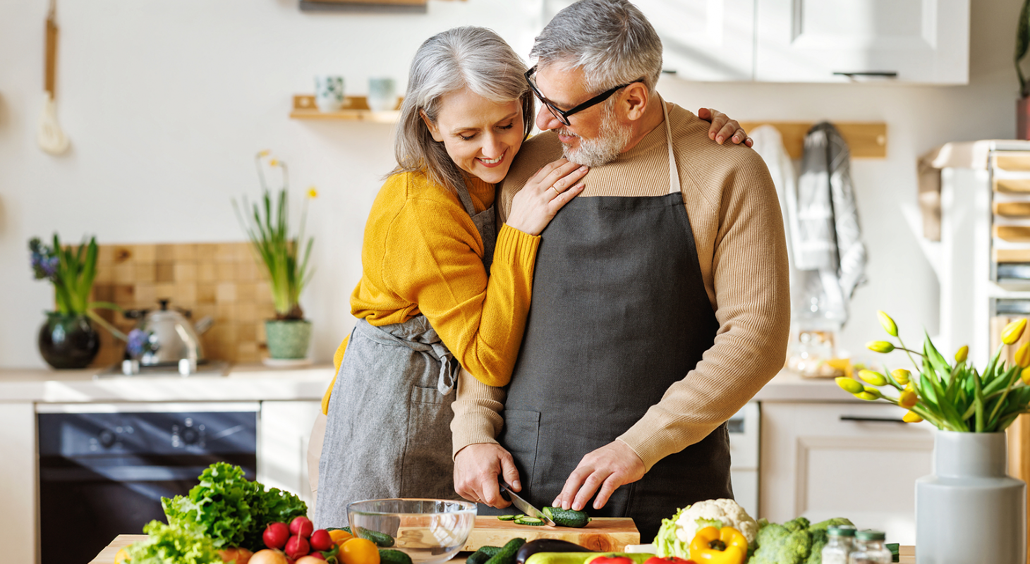 couple cooking sweet corn veloute with chive oil and crabmeat at home