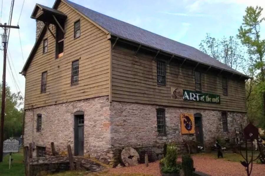 Art at the Mill sign on a barn